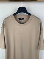 Louis Vuitton short-sleeve T-shirt, beige crew neck close-up with LV logo