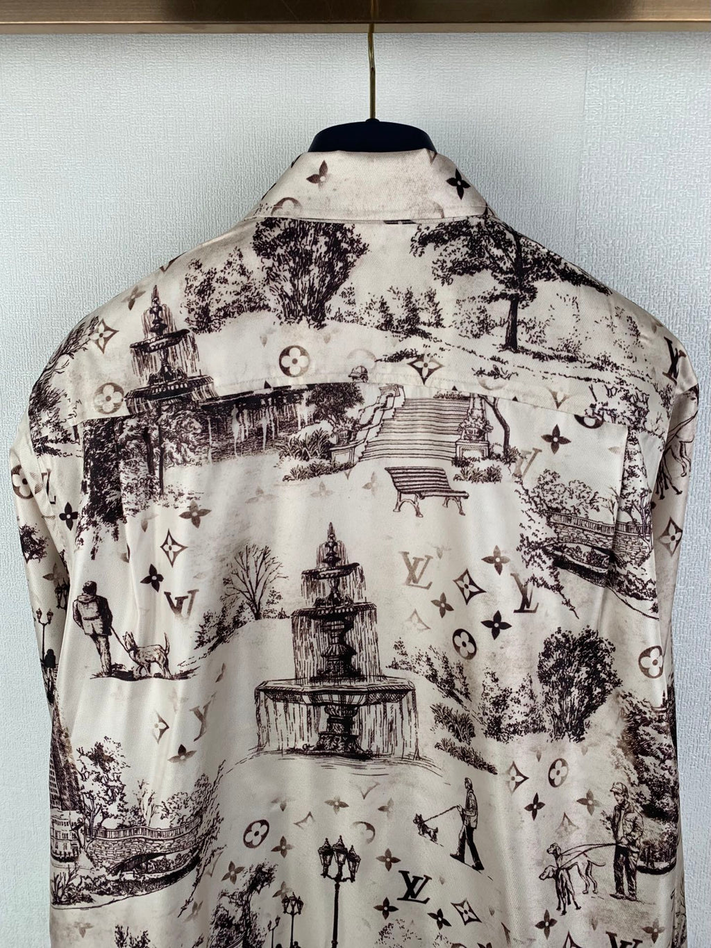Men's button-up long-sleeve shirt back view, white with dark city fountain print