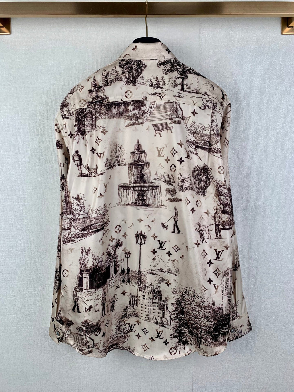 Men's button-up long-sleeve shirt back view, white with dark city and emblem print