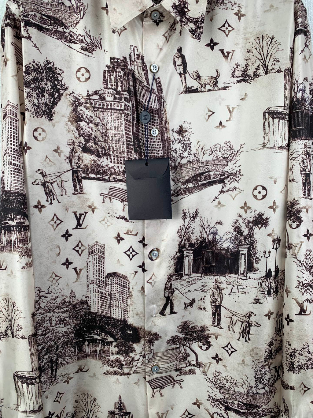 Men's button-up shirt, white with dark city scene print and round logo-style buttons