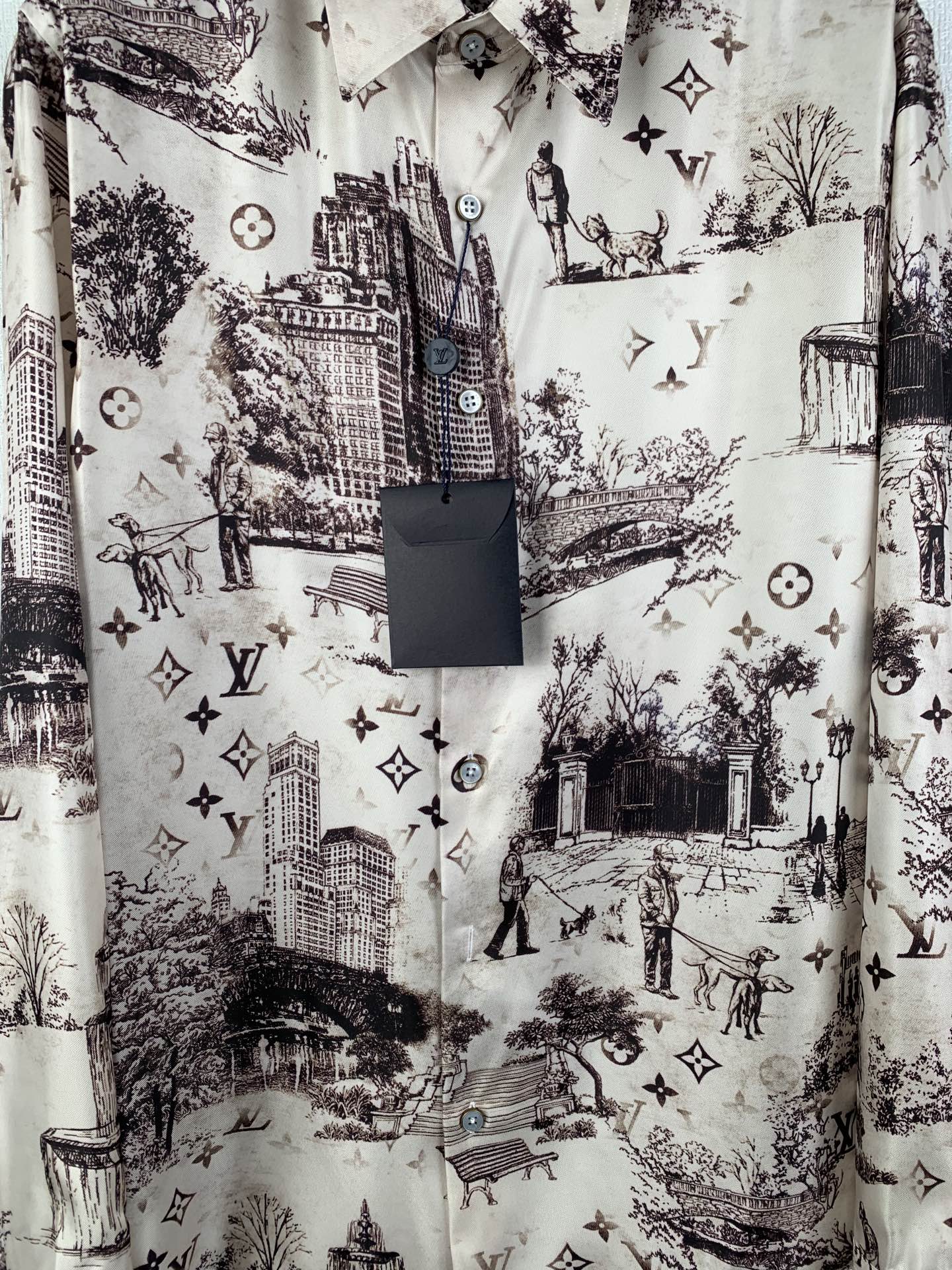 Men's button-up shirt, white with dark city scene print and round logo-style buttons