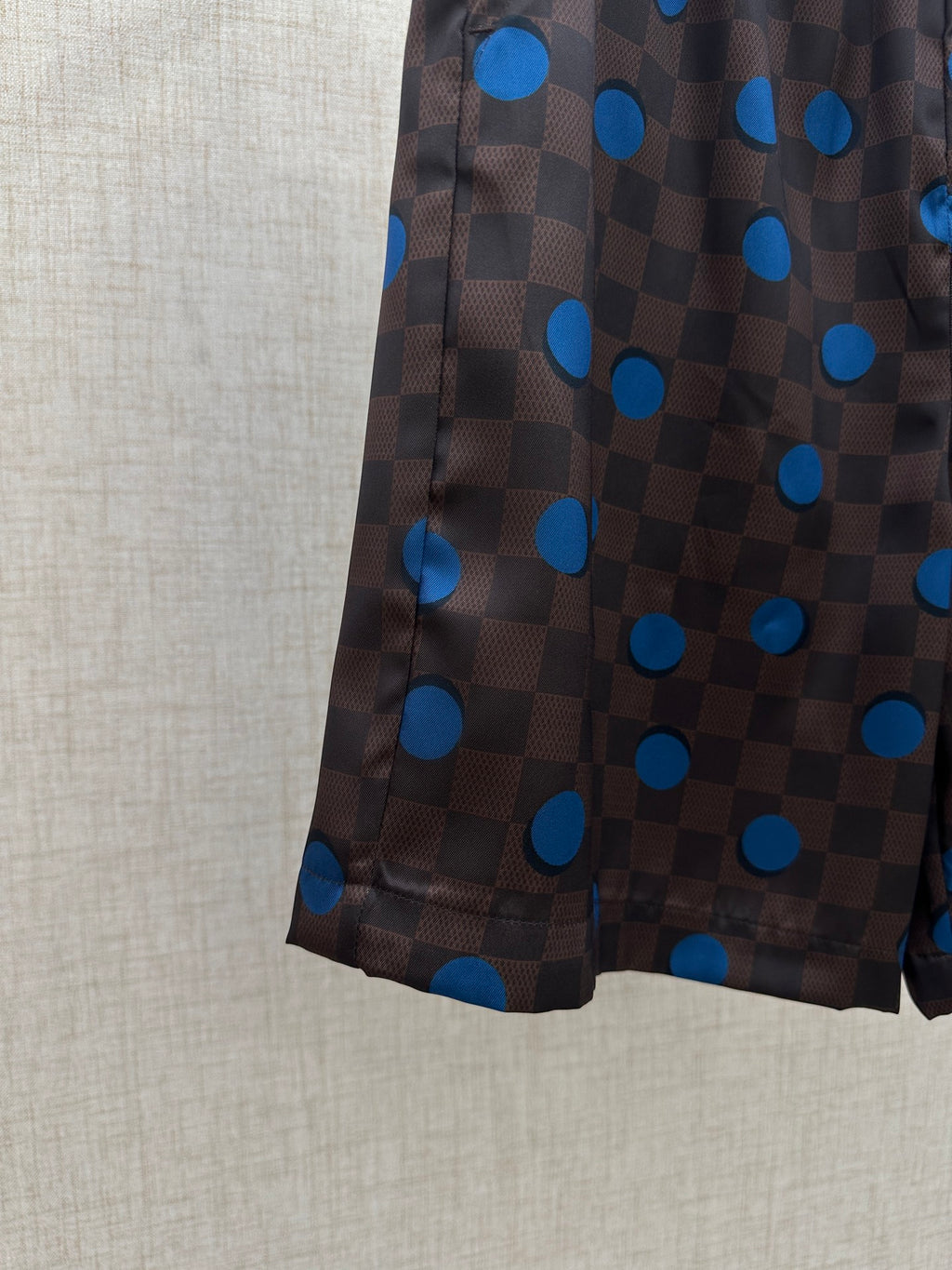 Brown shorts with allover blue polka-dot and check pattern