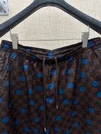 Brown shorts with elastic drawstring waist and blue dot and check print