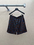 Brown shorts with elastic waistband and blue dot and check pattern