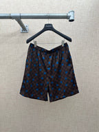 Brown shorts with elastic waistband and blue dot and check pattern
