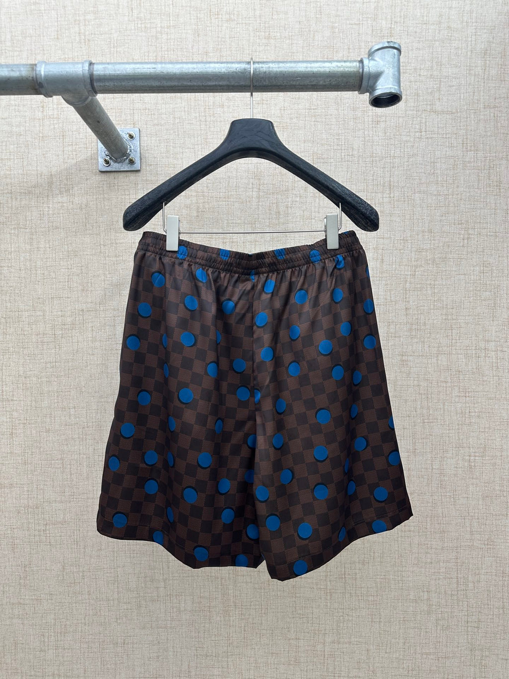 Brown patterned shorts with blue polka-dot and check design, elastic waist