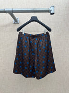 Brown patterned shorts with blue polka-dot and check design, elastic waist