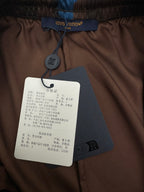 Louis Vuitton shorts interior label and care tag on brown fabric