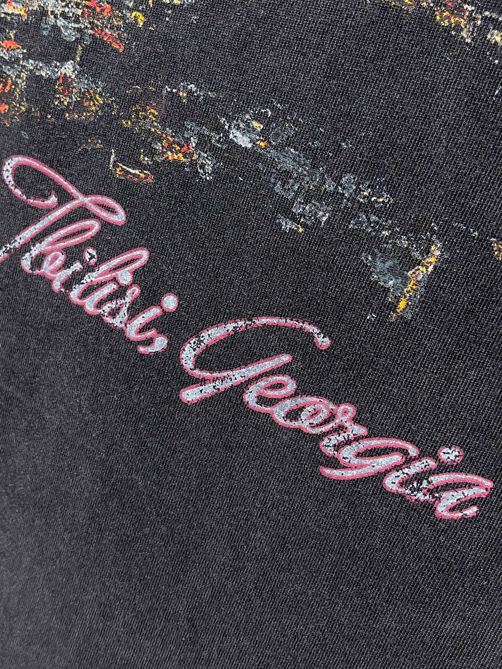 Dark blue T-shirt with pink cursive artwork text graphic