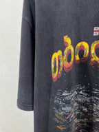 Dark blue T-shirt front with yellow and pink logo graphic and paint splatter