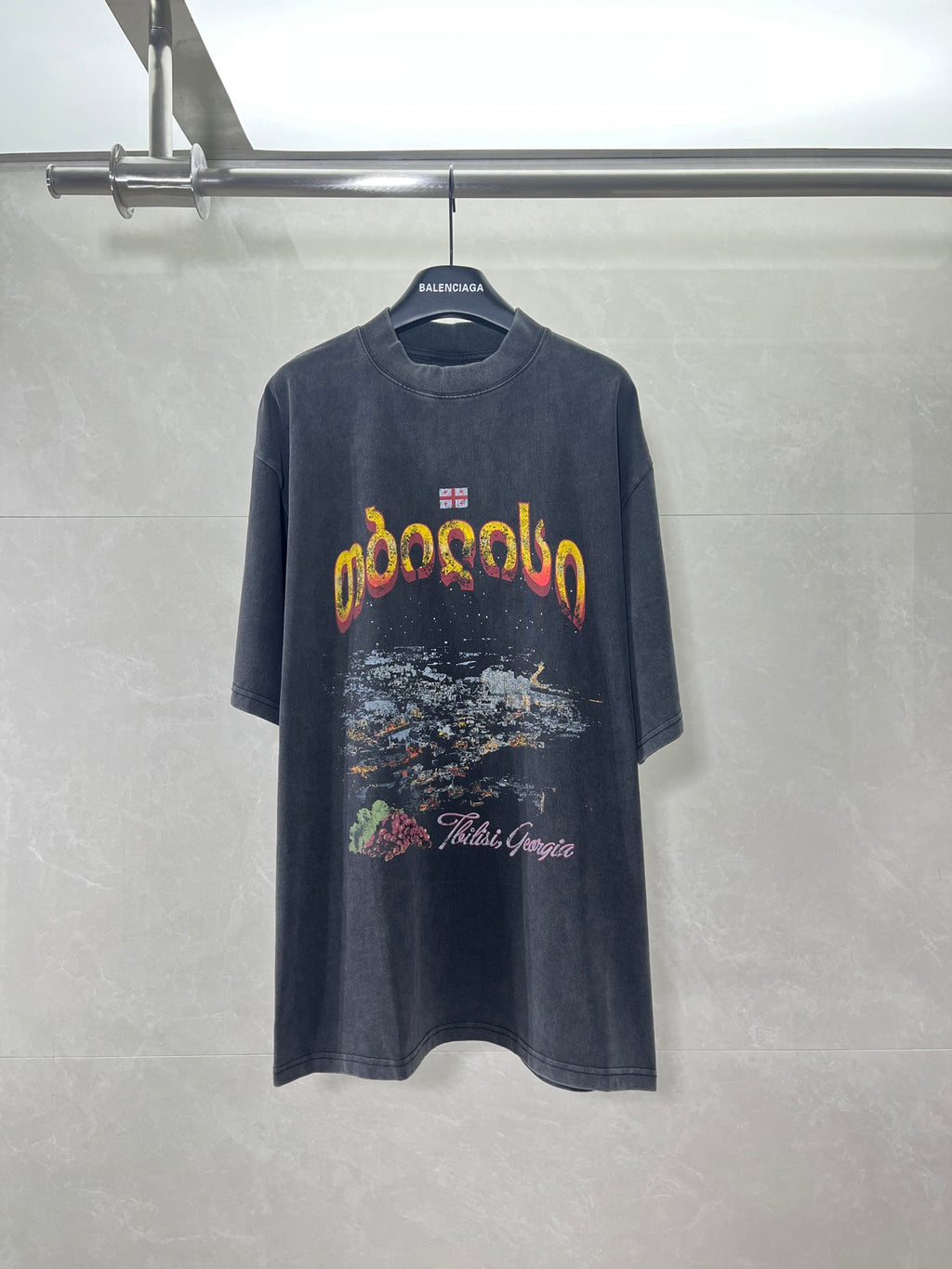 Balenciaga dark blue graphic T-shirt with colorful lettering and artwork