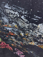 Dark blue T-shirt with distressed multicolor skyline graphic and speckles