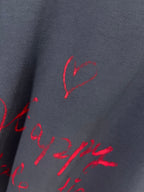 Balenciaga dark navy T-shirt fabric with red heart and script print close-up