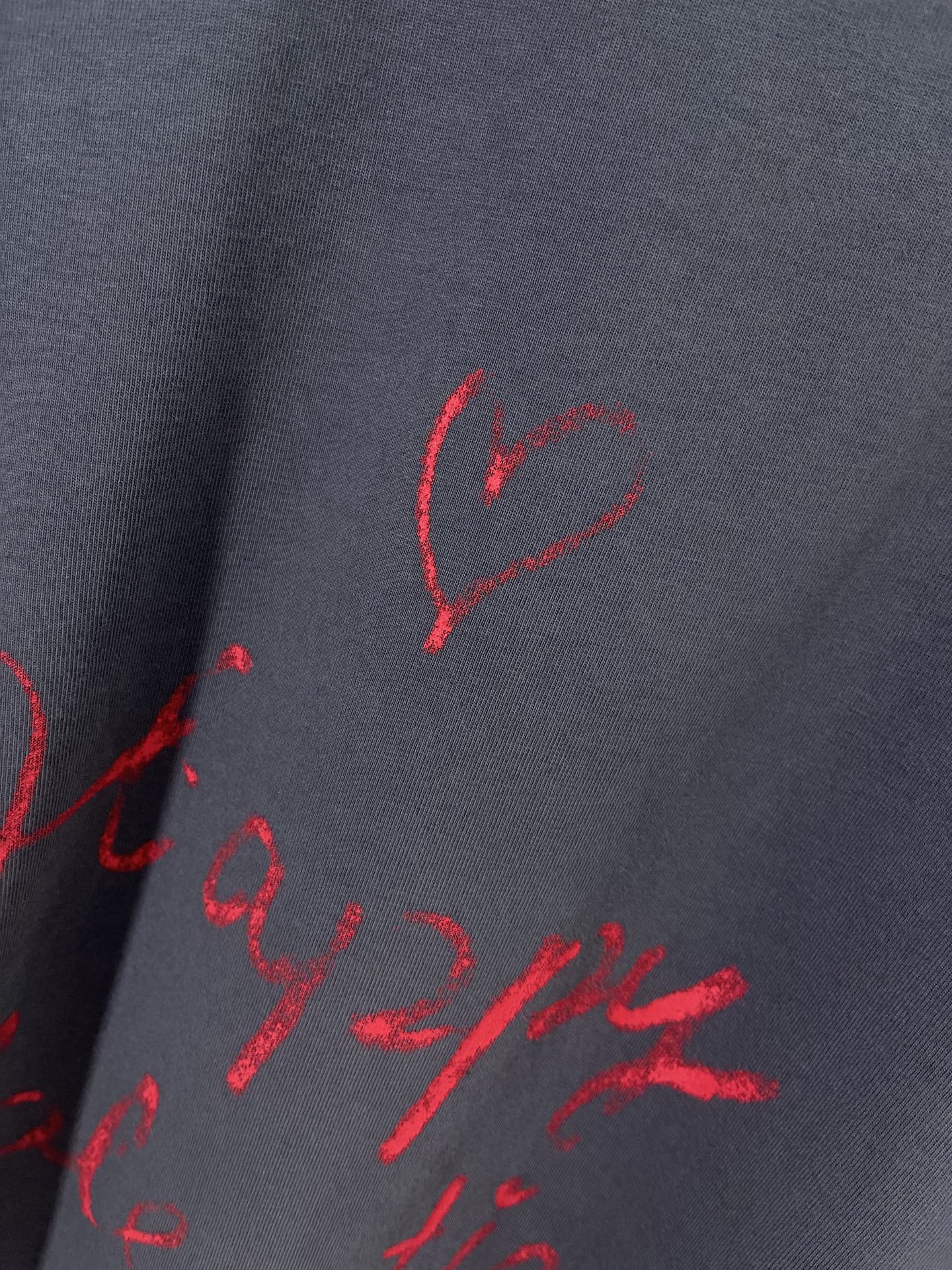 Balenciaga dark navy T-shirt fabric with red heart and script print close-up