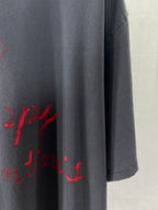 Balenciaga dark navy T-shirt hem and side seam with partial red script print