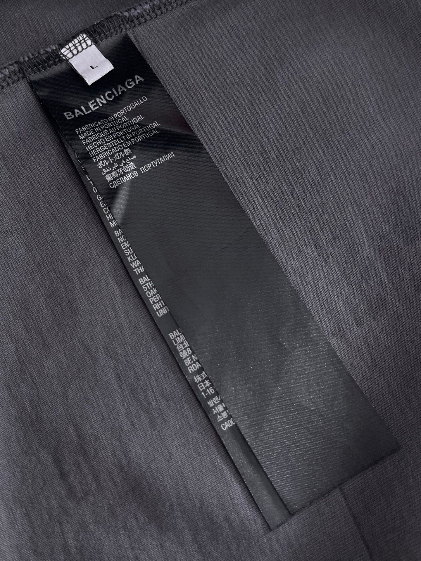 Balenciaga black fabric care label and size tag inside collar