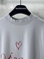 Balenciaga short-sleeve T-shirt close-up at neckline with red heart graphic
