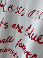 Balenciaga short-sleeve T-shirt close-up of red cursive Valentine’s text