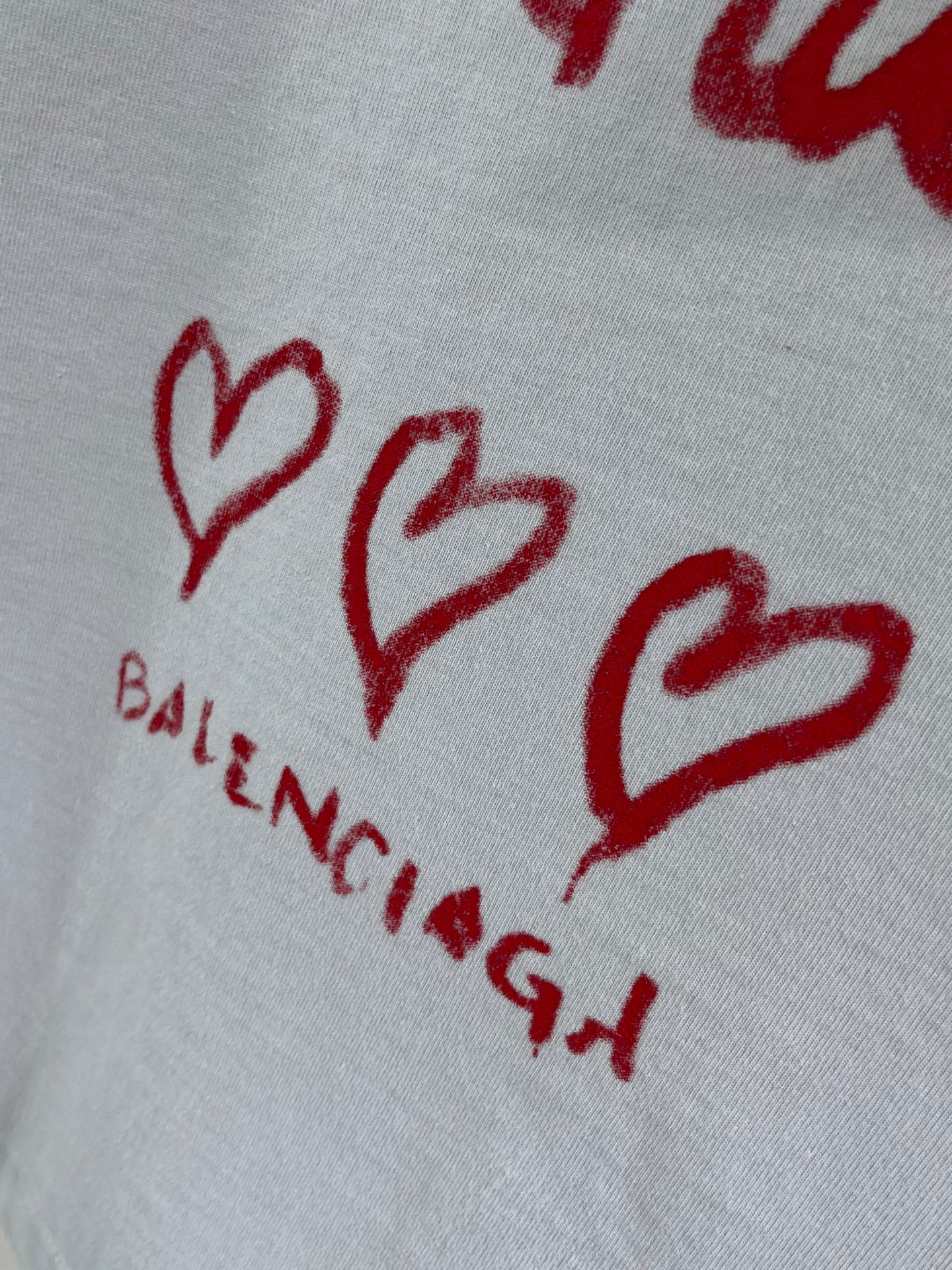 Balenciaga short-sleeve T-shirt close-up of red heart and “BALENCIAGA” stamp