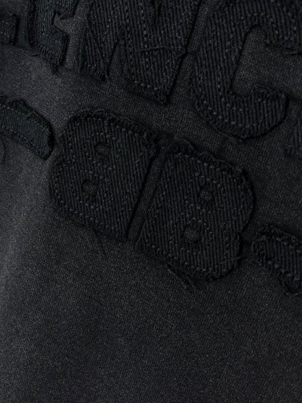 Balenciaga T-shirt close-up of textured logo lettering