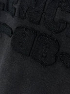 Balenciaga T-shirt close-up of textured logo lettering