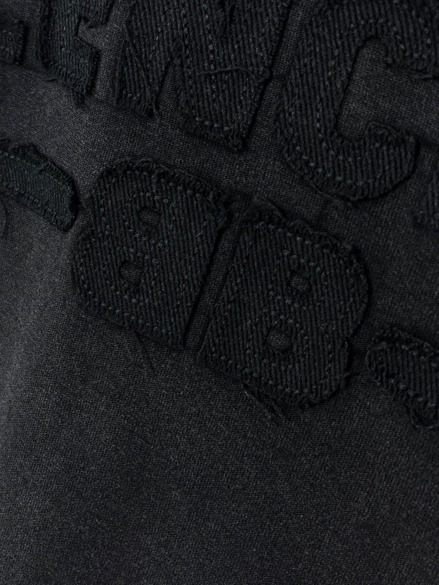 Balenciaga T-shirt close-up of textured logo lettering