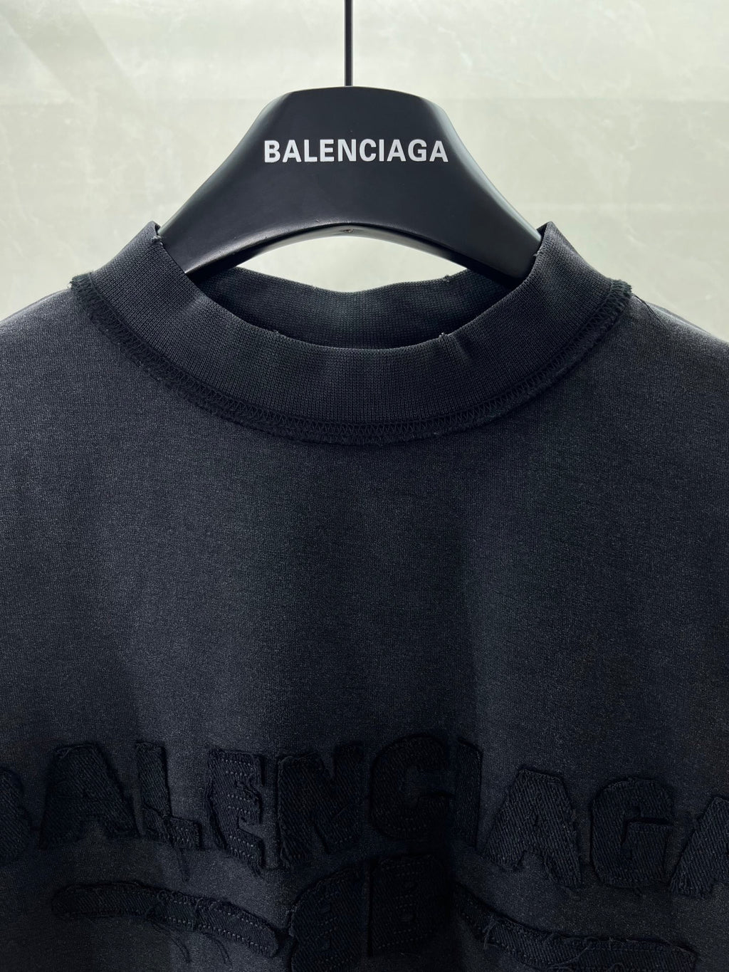 Balenciaga T-shirt neckline with brand name text on inner collar