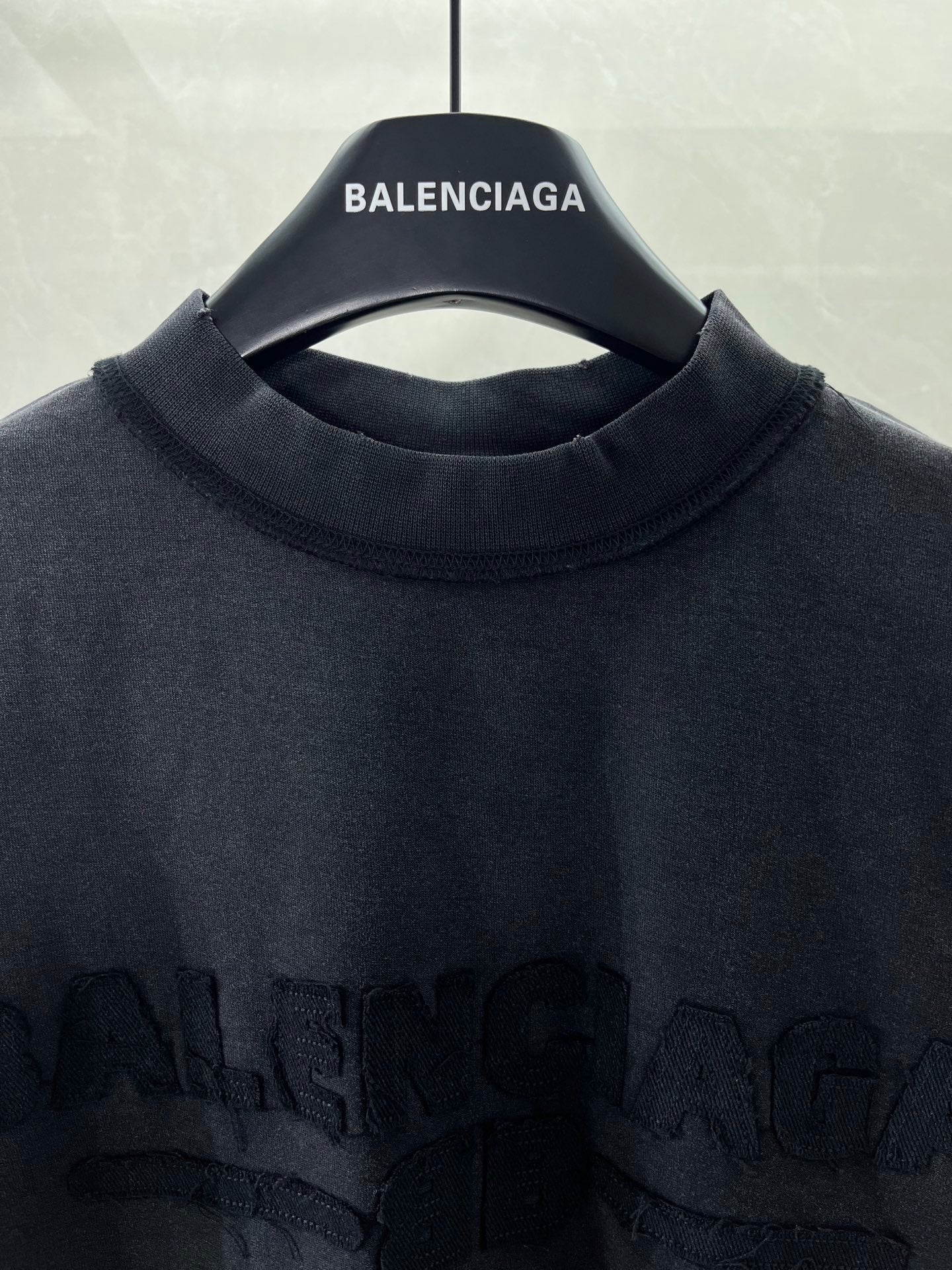 Balenciaga T-shirt neckline with brand name text on inner collar