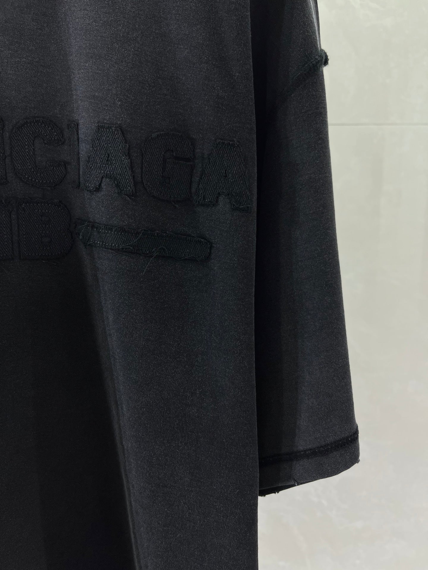 Balenciaga T-shirt with large dark logo print near front hem