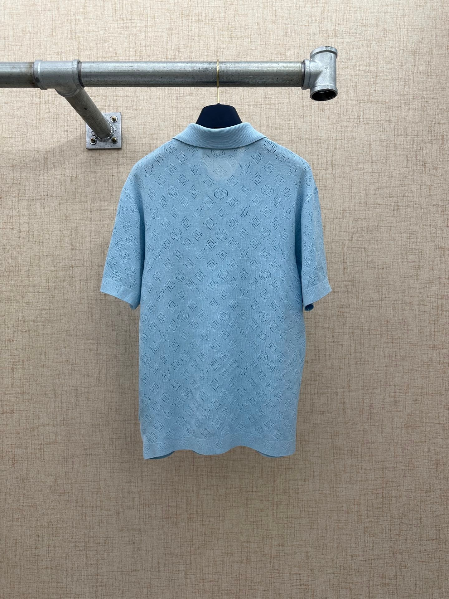 Light blue polo shirt back view with short sleeves