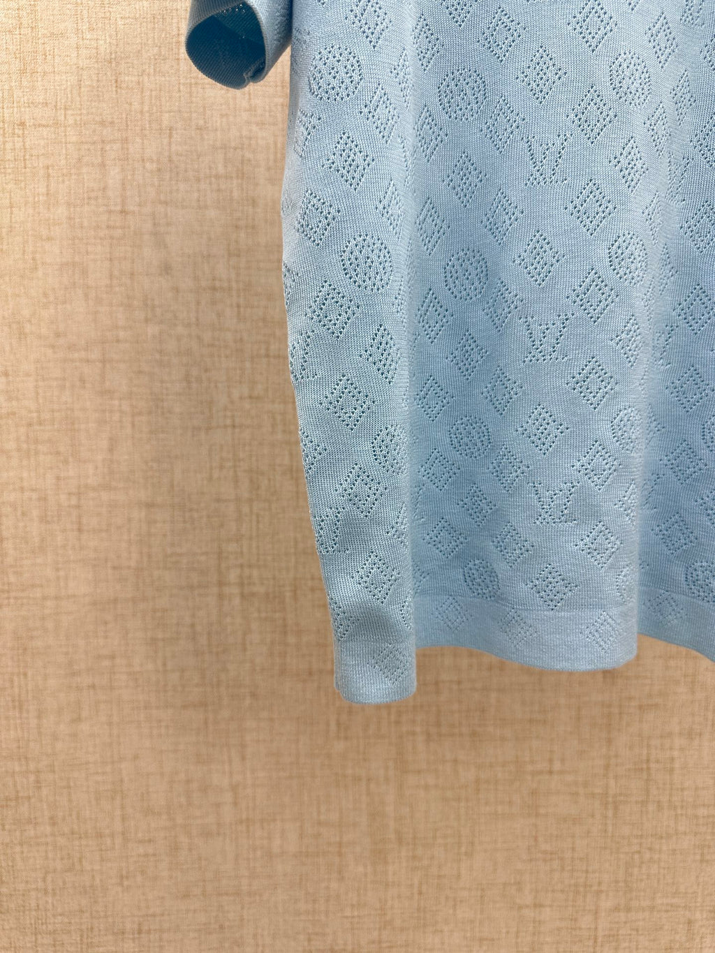 Light blue polo shirt hem and side view