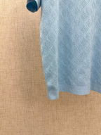 Light blue polo shirt hem and side view