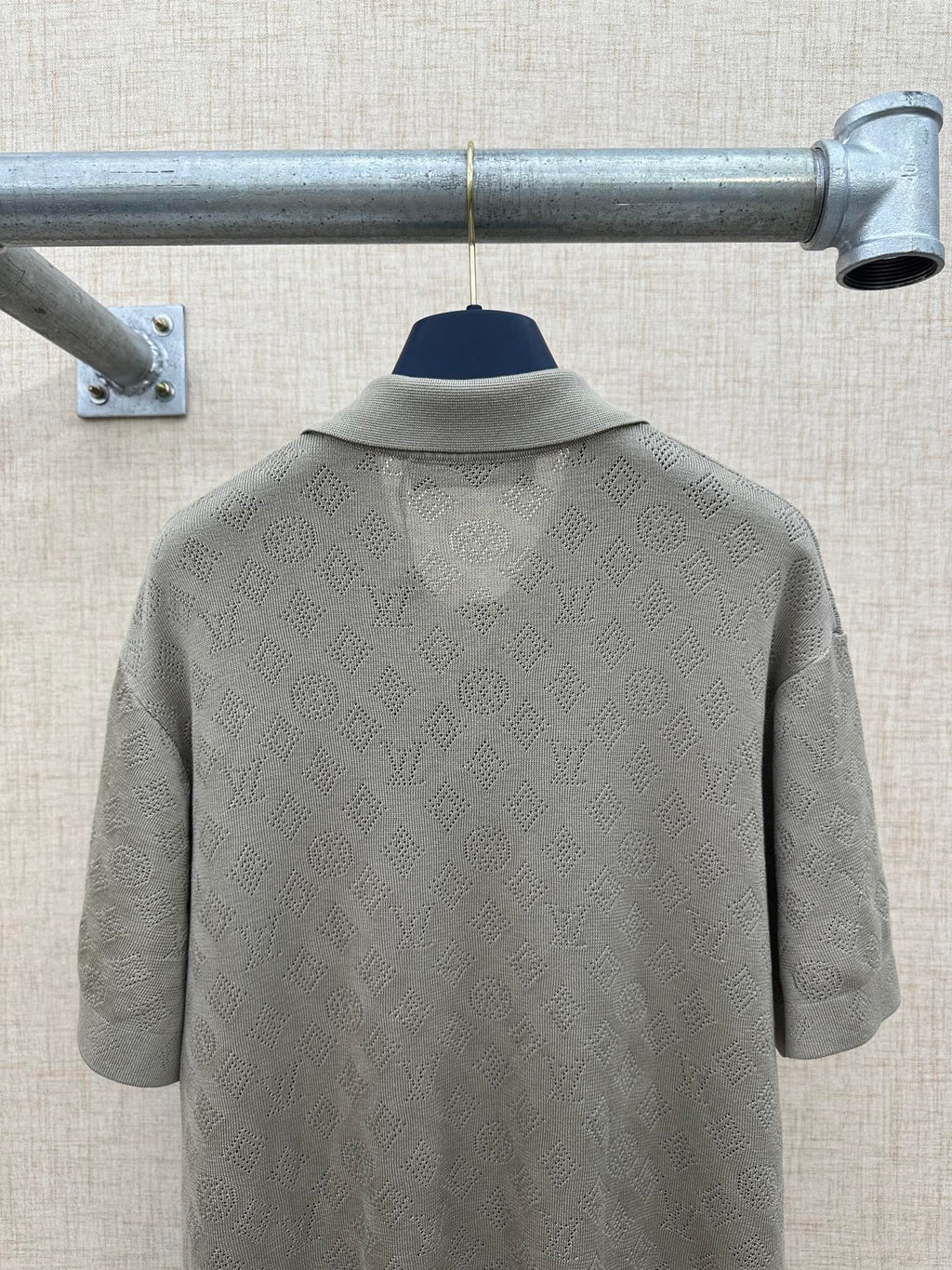 Light gray polo shirt back with raised collar detail