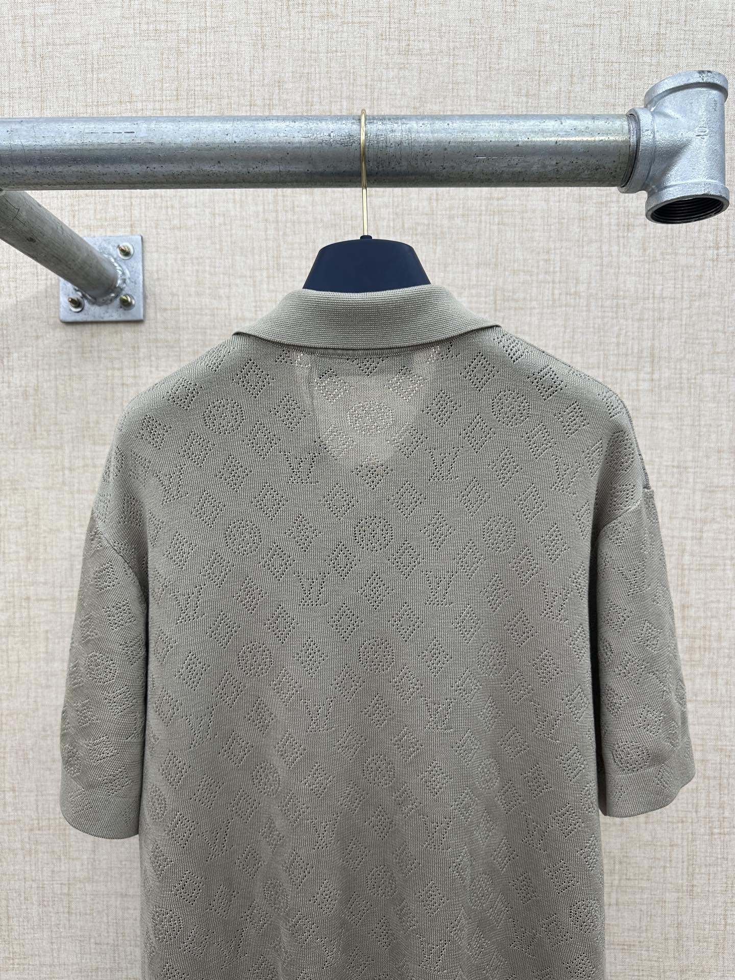 Light gray polo shirt back with raised collar detail