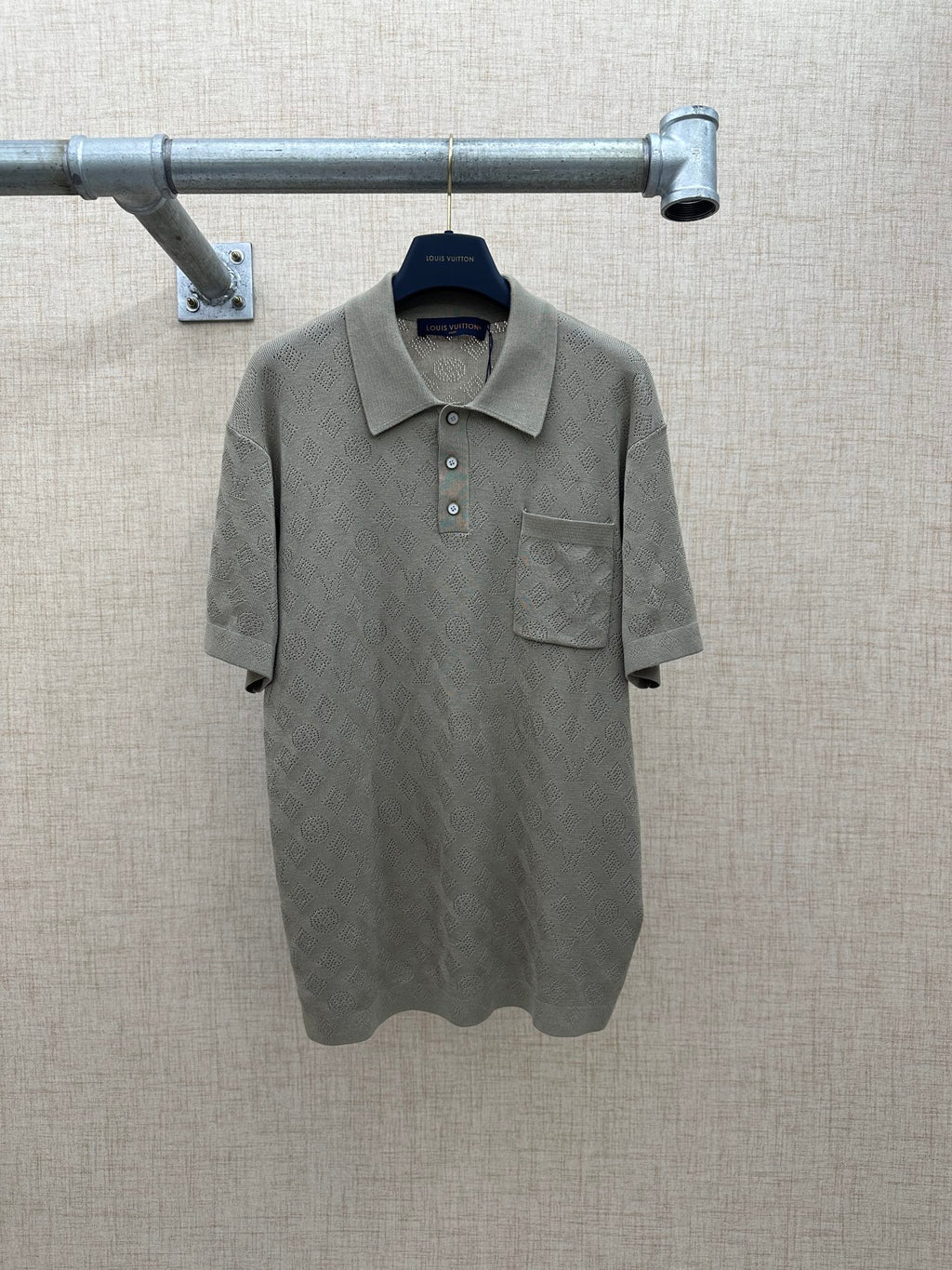 Light gray polo shirt with button placket and chest pocket
