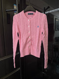 Pink cable-knit cardigan sweater with button front and small Polo logo on chest.