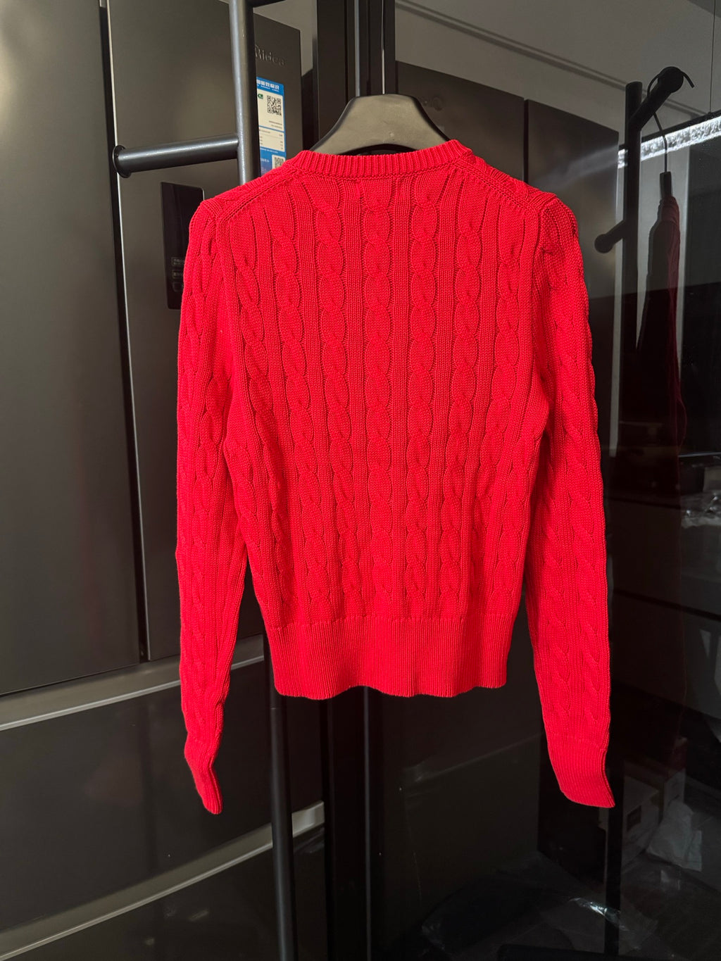 Ralph Lauren cable-knit cardigan, red, back view with ribbed hem and button placket