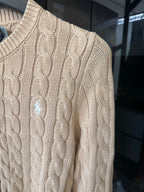 Ralph Lauren cable-knit cardigan detail, light tan knit texture, small logo embroidery