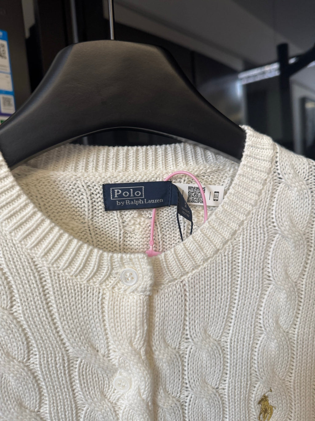 Ivory cable-knit sweater collar with Polo Ralph Lauren label and button