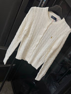 Ivory cable-knit sweater with crew neck, long sleeves, small pony logo