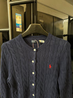 Dark gray cable-knit cardigan with button front and red polo logo