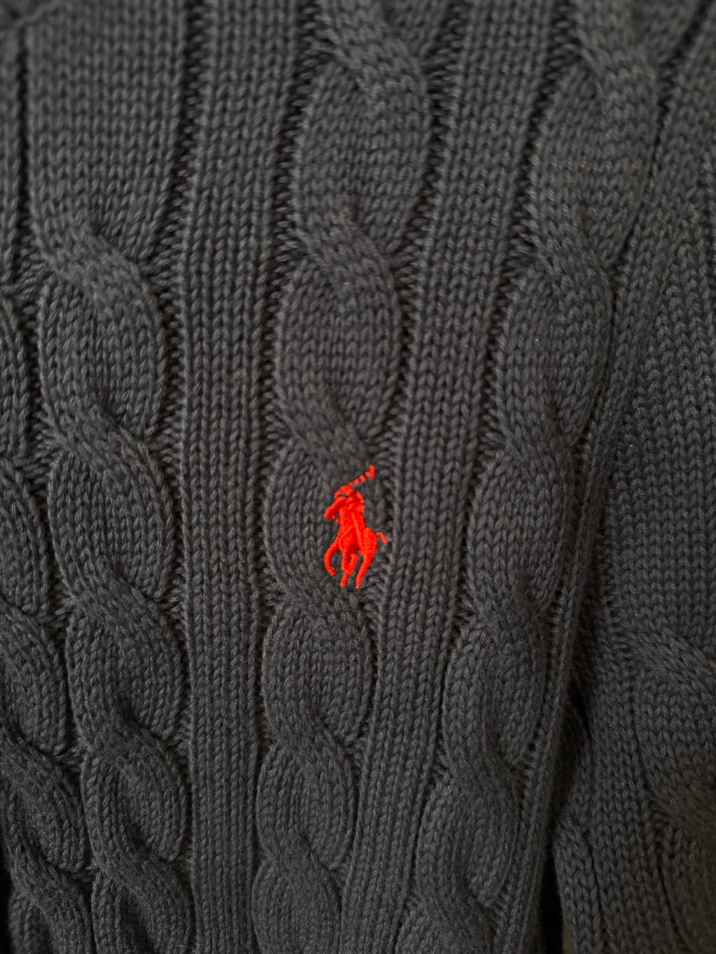Cable-knit fabric with red polo logo