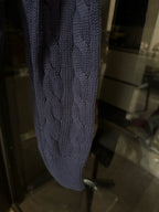 Navy cable-knit cardigan sleeve with cable pattern