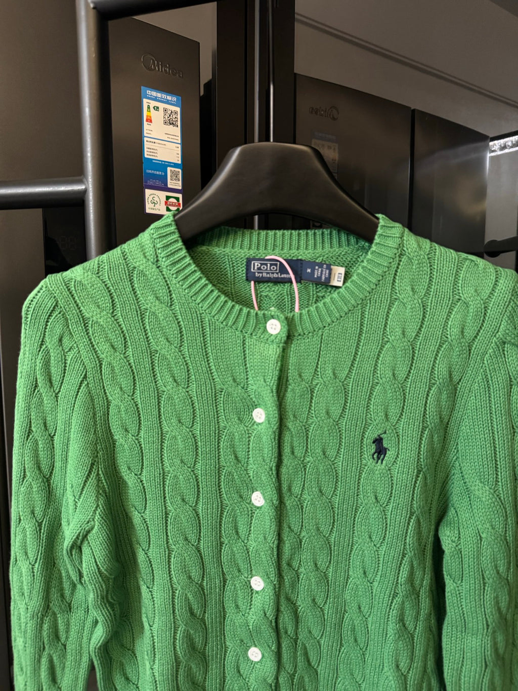 Green cable-knit Polo Ralph Lauren cardigan with button front and small logo