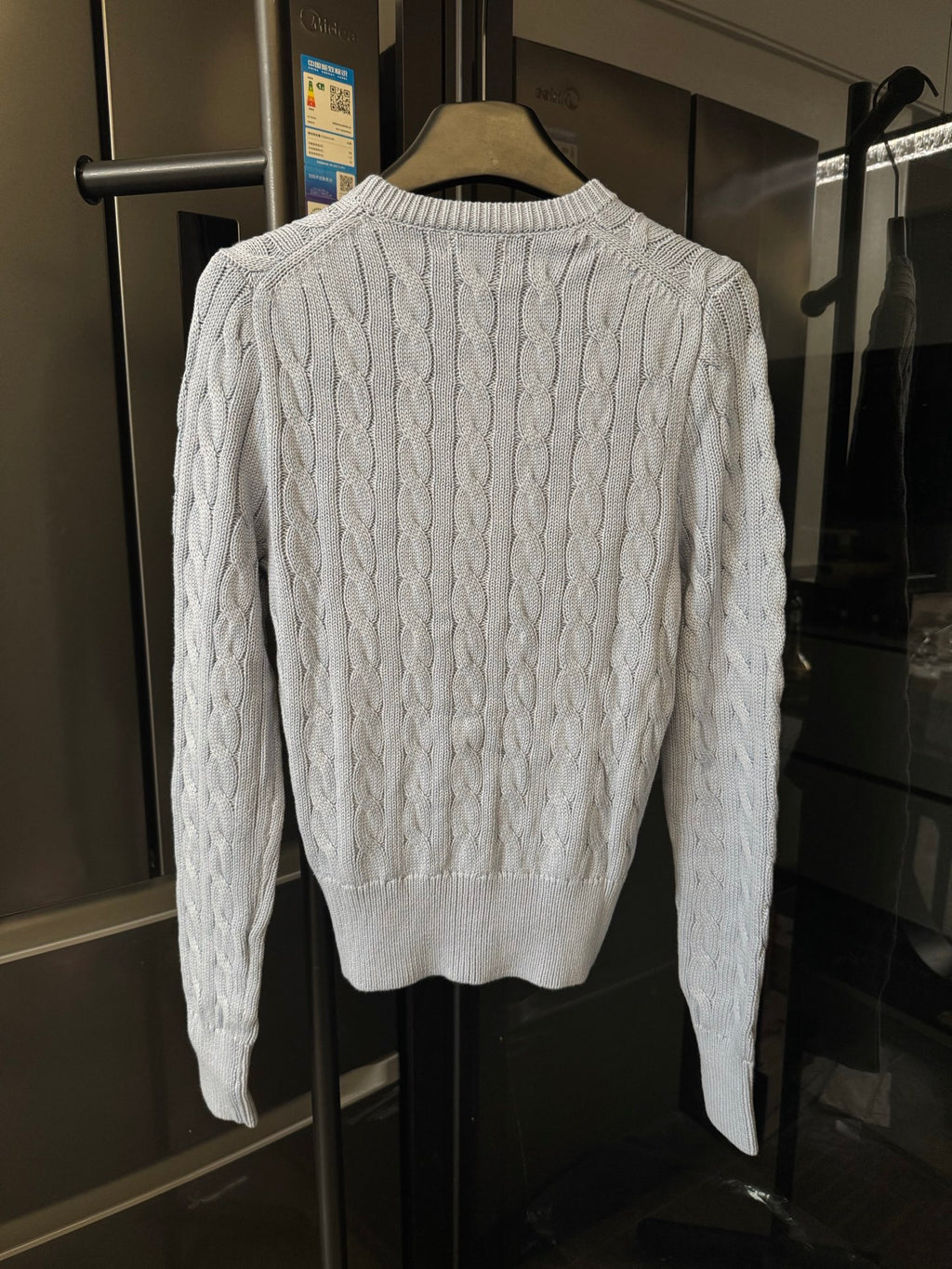 Ralph Lauren cable-knit cardigan sweater, cream cable pattern on the back.