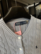 Ralph Lauren cable-knit cardigan neckline, cream knit with button placket and Polo logo.