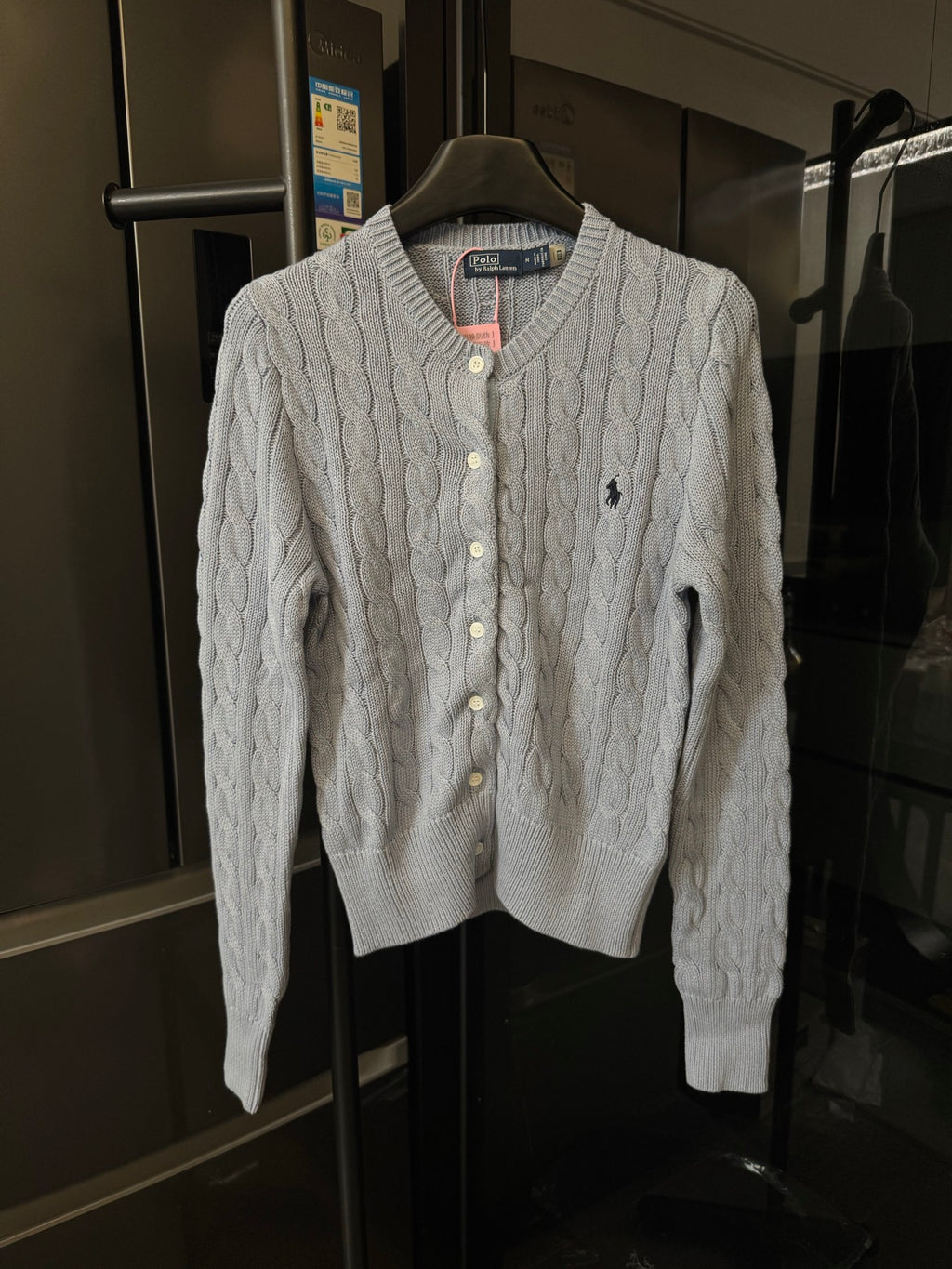 Ralph Lauren cable-knit cardigan sweater, cream with button front and Polo logo.