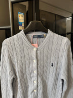 Ralph Lauren cable-knit cardigan with cream knit, button front, and embroidered Polo logo.