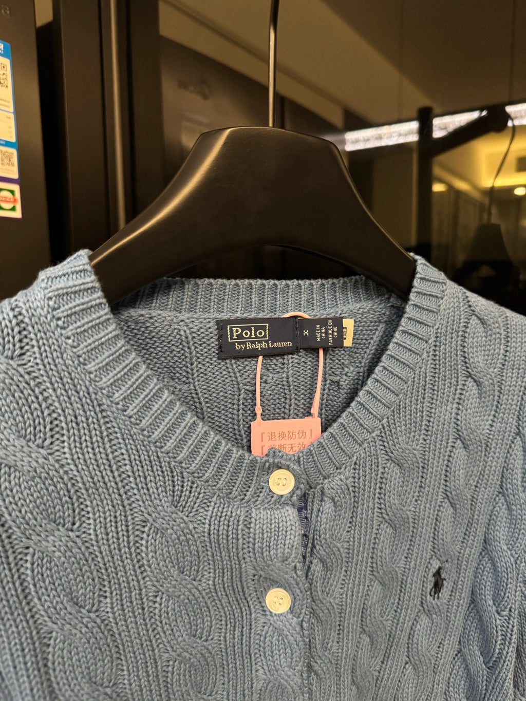 Ralph Lauren cable-knit cardigan neckline detail, light blue buttons and brand tag