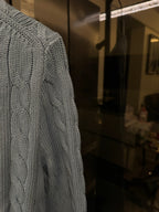 Ralph Lauren cable-knit cardigan, light blue, side view of textured cable pattern